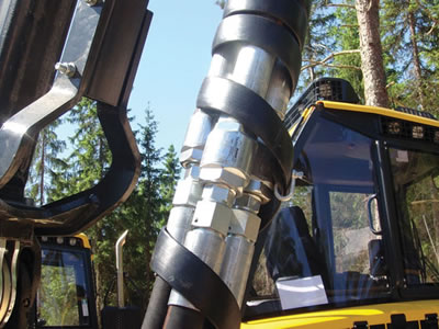 Several hydraulic hoses are installed on a harvester
