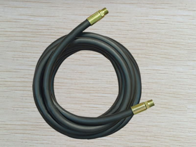 A hydraulic hose assembly in roll with black cover.
